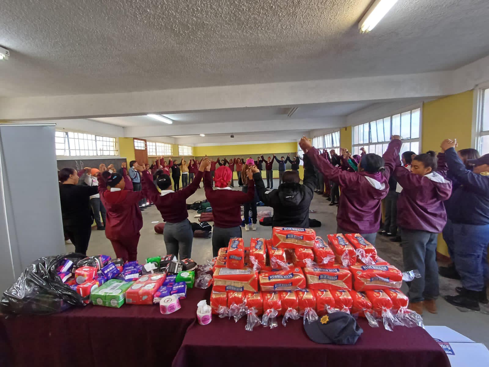 Packets of sanitary pads reaching a community through Woman2Woman
